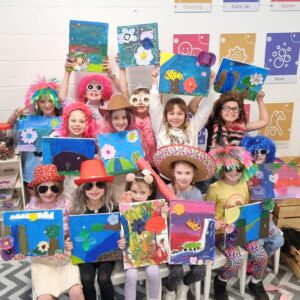 Children displaying their paintings at a birthday party at Floreat Forum Maker Space